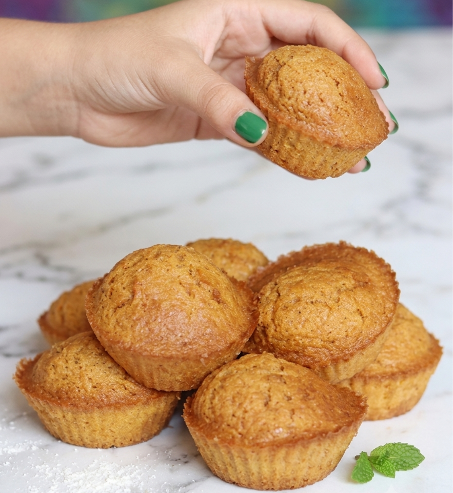 Golden baked carrot muffins fresh out of the air fryer in silicone cups