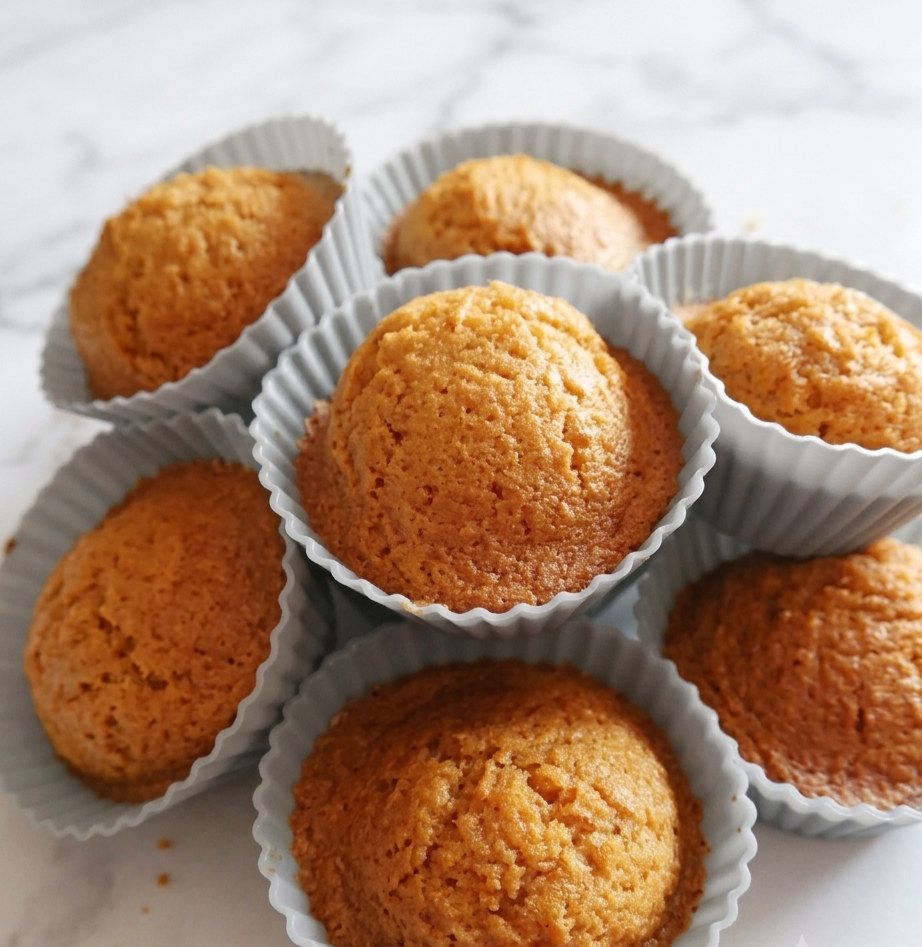 Muffin cups filled with carrot batter ready for the air fryer