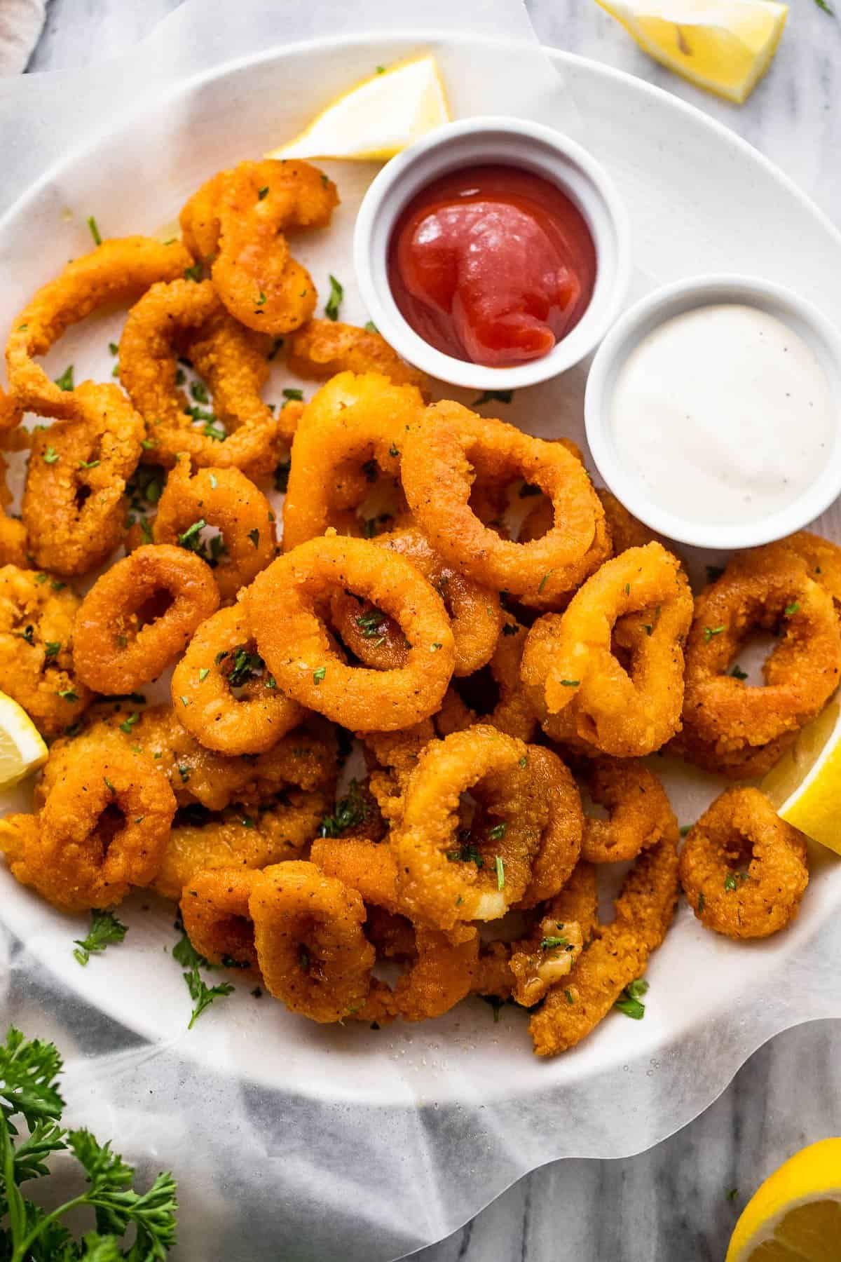 Crispy calamari rings served with fresh lemon and dipping sauces