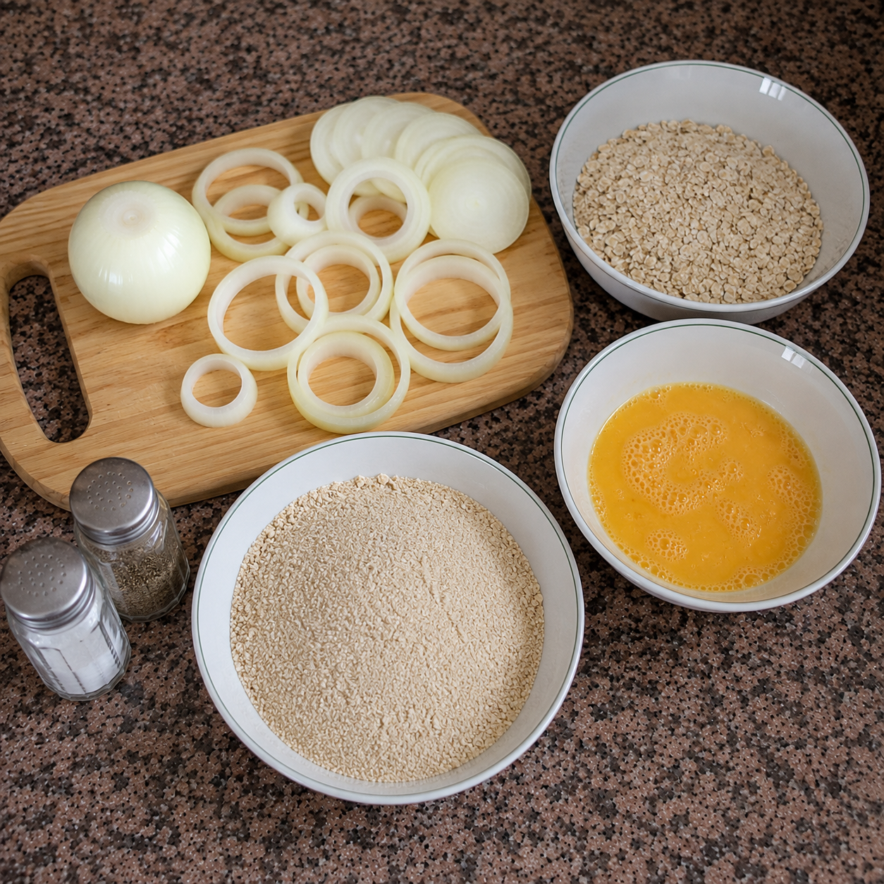Ingredients for oat-coated onion rings: oats, onion, egg, salt, and pepper